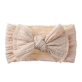 Bandeau bébé en tricot blanc crème avec un grand nœud et motif torsadé doux - Blanc Cassé