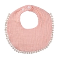 Close-up of pink cotton gauze baby bib featuring white pom-pom trim and adjustable snap buttons - Pale Green