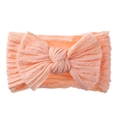 Bandeau élastique pour bébé rose chair avec un grand nœud en maille côtelée douce - Bourgeon de Neige