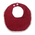 Detail view of burgundy muslin cotton baby bib featuring white pompom trim and snap buttons - Burgundy