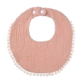 Detail of pink cotton muslin baby bib with pom-pom trim and adjustable snap buttons - Blush Pink
