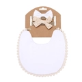 Detail of white cotton lace bib and two matching bow headbands on a kraft card - White