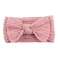 Bandeau bébé rose en maille jacquard avec grand nœud et texture torsadée - Rose