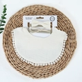 Close-up of cotton baby bib with polka dot lace and matching green bow headbands - Beige