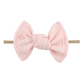 Macro detail of pink waffle fabric bow headband with high elasticity for infants - Light Pink