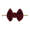 Detailed close-up of dark red waffle textured bow on a nude nylon baby headband - Burgundy