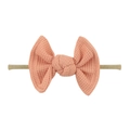 Detail of baby waffle knit bow headband in coral pink with high-elastic nylon band - Blush Pink