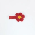 Detailed macro view of a red knitted flower hair clip with yellow center and fabric wrap - Red Yellow Center (PP182-20)