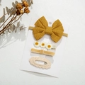 Close-up of a 4-piece set of knitted hair clips and headbands on a display card - Bright Yellow Style(DP104-6)