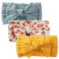 Detailed close-up of soft ribbed nylon baby headbands with large bows in three colors - Haze Blue Floral Set (KK168-27+KK168-7#+KK168-30)