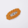 Handmade knitted cotton lace hair clip in bright orange yellow on a clean white background - Ginger Yellow (PP181-43)