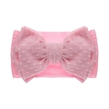 Détail du bandeau bébé rose en nylon avec un grand nœud à motif de pois texturé - Rose Clair