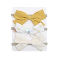 Detailed macro view of three fabric bow headbands with floral and solid patterns - Ginger Floral And Creamy White Style (DP114-7)
