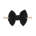 Detail of the woven texture on a black cotton knit bow with soft nylon baby headband - Black Style (EE125-1)