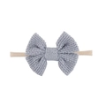 Macro detail of sky blue knitted cotton bow on a soft nylon elastic baby headband - Sky Blue Style (EE125-9)