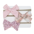 Close-up of three baby headbands with pink, plaid, and floral bows on nylon bands - Pink Plaid Floral Style (DP123-2)