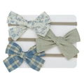 Detailed close-up of three newborn headbands with floral, solid green, and plaid bows - Off-white Print Bean Green Plaid Style (DP123-6)
