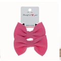 Two-pack pink bubble textured fabric bow hair ties on white retail hanging card - 2-Piece Set / Pink