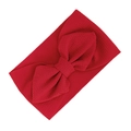 Elastic red waffle fabric baby headband featuring a large textured bow design - Red
