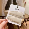 Pair of beige fabric BB hair clips with delicate scallop lace edges on display card - Pp174-46
