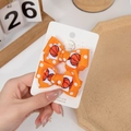 Handmade orange basketball print bow hair clips for kids on a white display card - Orange Basketball Style (PP219-1)