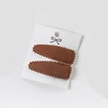 Set of two brown fabric hair clips with wave lace edges on a white display card - Pp174-57
