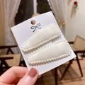 Set of two cream white lace embroidered hair clips on a card display for children - Pp174-69