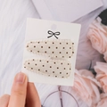 Set of two polka dot fabric BB hair clips with lace trim on a white display card - Off-White Brown Polka Dot (PP174-75)