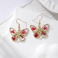Orecchini a farfalla vintage con fiori secchi rossi e decorazione a rilievo con fata dorata - Farfalla Fiore Rosso