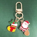 Detailed close-up of a Santa Claus and Christmas stocking alloy keychain charm - Christmas Sock and Santa