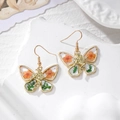 Orecchini a farfalla vintage con fiori secchi arancioni e ciondolo a forma di fata - Farfalla Fiore Arancione Foglia Verde