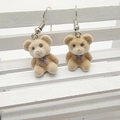 Detailed view of cute brown flocked teddy bear earrings with gray bows on white display - Brown Bow Bear