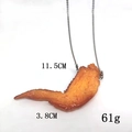 Macro view of realistic roasted chicken leg pendant with precise size and weight details - Orleans Chicken Wing
