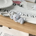 Cute gray flocked koala keychain sleeping pose on wooden decor for bag charm - Sleeping Style