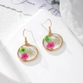 Fashionable round resin earrings with real dried flowers and golden hooks on marble - Rose Red Green Flowers