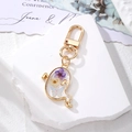 Ghost shaped Halloween keychain with white and purple dried flowers in transparent resin - White Purple Flower Little Ghost