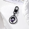 Portachiavi artigianale con luna nera e fiori secchi viola in resina a goccia - Fiore di Luna
