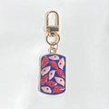 Vintage boze oog sleutelhanger met blauwe emaille hanger en gouden karabijnsluiting - Donkerblauw met rode ogen