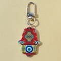 Detailed view of the red Hamsa Hand keychain with Evil Eye print and mandala patterns - Red Blue Round Eye Hand