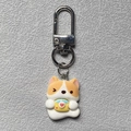 Close-up of cute 3D Corgi dog keychain charm with heart bowl and silver metal clasp - Yellow Envelope Puppy