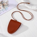 Brown leather neck hanging key case with white stitching on a natural fabric background - Brown Glasses Clip
