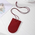 Detail of red lychee pattern faux leather key case with fine stitching and woven lanyard - Wine Red