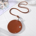 Detail of round brown leather sunglasses clip with white stitching and silver snap button - Round Brown