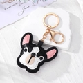 Schicker schwarz-weißer Leder-Bulldogge-Schlüsselanhänger mit goldenem Karabiner - Schwarzer Welpe