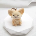 Detail of a cute beige flocked fox keychain with winking face on white geometric stand - Flocking Wink Fox