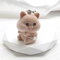 Detailed macro view of light brown flocked animal keychain with soft texture and metal ring - Flocking Backpack Dog