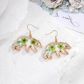 Golden polar bear earrings featuring real green dried flowers in clear resin drops - Green Flower Polar Bear