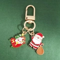 Porte-clés de Noël en alliage avec Père Noël et bonhomme de neige sur traîneau - Traîneau et Père Noël