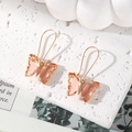 Elegant gold butterfly earrings with pink translucent wings and sparkling crystals - Light Pink