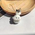 Detailed close-up of a cute white flocked bunny keychain with silver metal clip and soft fur - Head-touching White Bunny